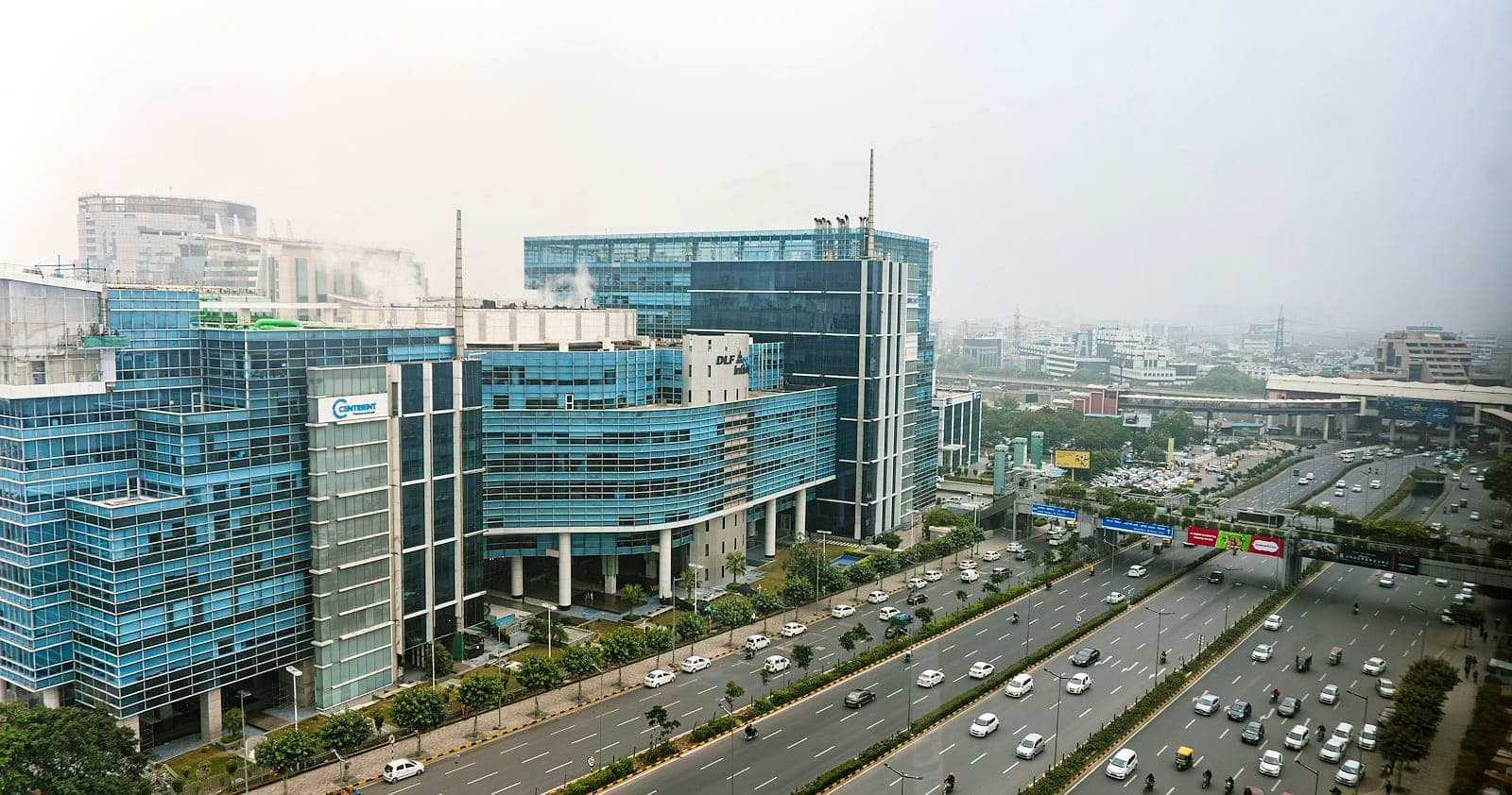 Glass office campuses along the NH-48 expressway near DLF Cyber City, the IT and business hub of Gurgaon (Gurugram)