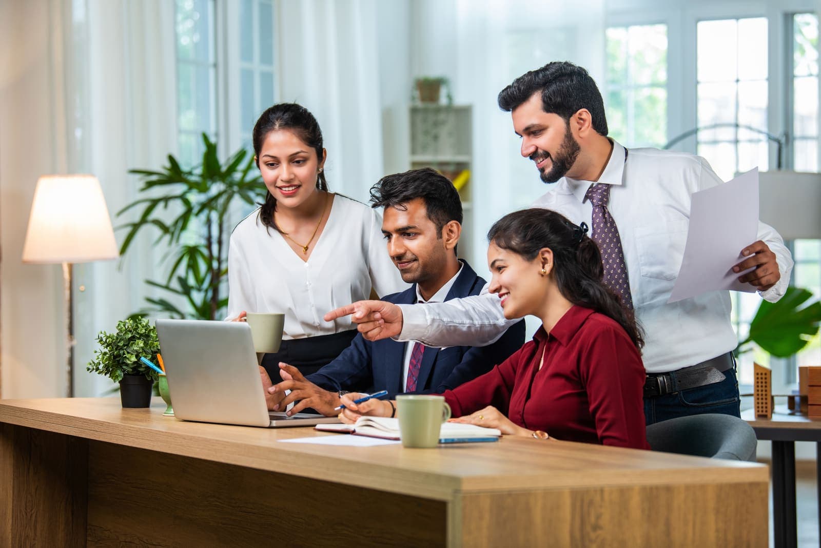 The CodeVibe team at work in a Gurgaon office, collaborating on a client project.