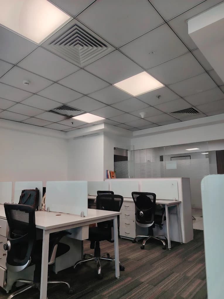 Open-plan desks and chairs in the Codevibe office in Gurugram