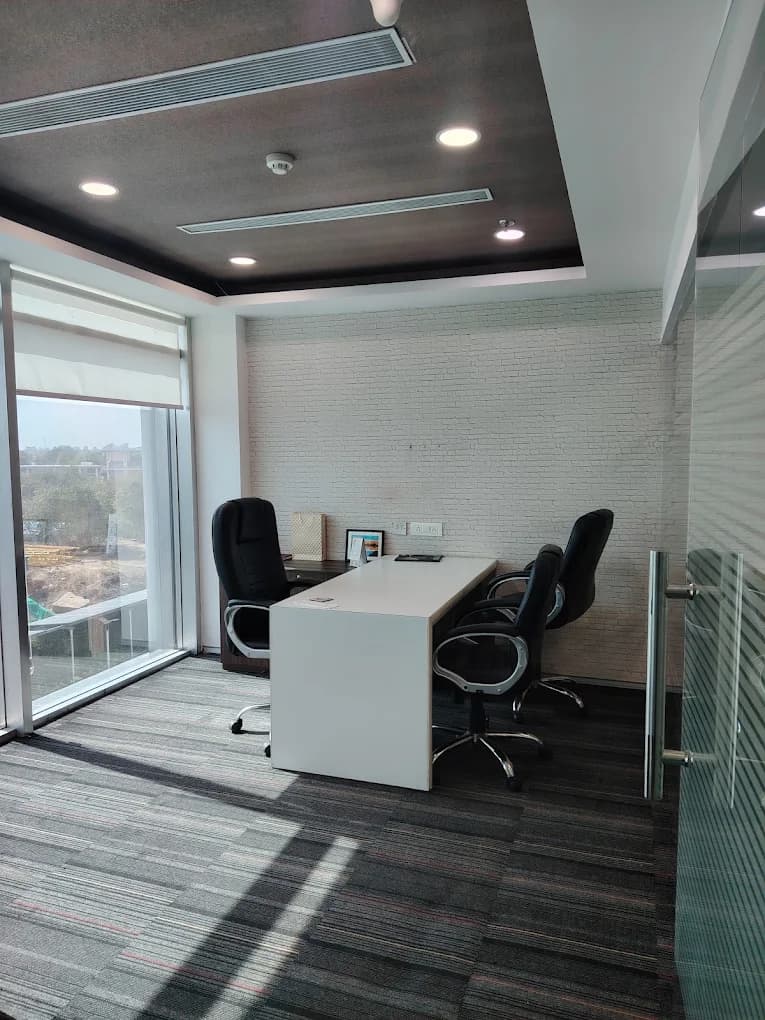 A meeting room at the Codevibe office, with a window looking out over Gurugram